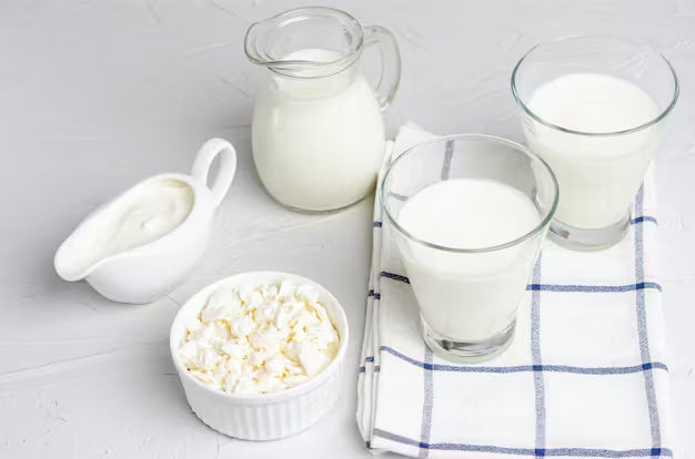 glass of plain kefir white background natural light