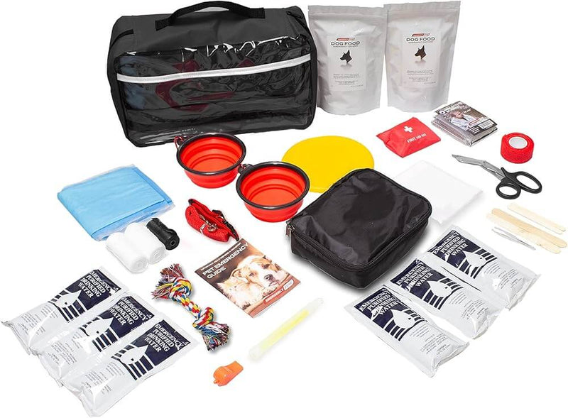 Emergency dog kit with a black bag, dog food packs, collapsible red bowls, rope toy, first aid kit, water pouches, leash, and safety gear.