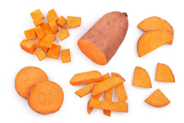Whole and sliced sweet potato pieces in various cuts on a white background